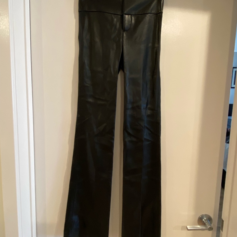 Alice & Olivia flared faux leather pants.